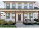 Charming two-story home featuring a covered porch with wooden columns and a landscaped front yard at 5413 Austin Rd # 4, Monroe, NC 28112