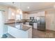 Beautiful kitchen features stainless steel appliances, granite countertops, and ample white cabinetry for storage at 5413 Austin Rd # 4, Monroe, NC 28112