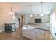 Open-concept kitchen flows into the living area, offering a breakfast bar and modern stainless steel appliances at 5413 Austin Rd # 4, Monroe, NC 28112