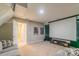 This living room features a projector and a gray sofa at 5413 Austin Rd # 4, Monroe, NC 28112