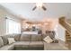 Spacious living room offers natural light, with an open view to the modern kitchen featuring stainless steel appliances at 5413 Austin Rd # 4, Monroe, NC 28112