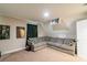 A comfortable theater room with a large gray sectional and dark green curtains at 5413 Austin Rd # 4, Monroe, NC 28112
