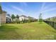 Backyard with a lush lawn, a fence, and landscaping that add privacy at 6416 Willow Pin Ln, Huntersville, NC 28078