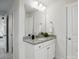 Bathroom vanity featuring granite countertops, white cabinets, and chrome fixtures at 6416 Willow Pin Ln, Huntersville, NC 28078