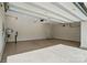 Spacious garage featuring an epoxy floor, utility connections, and an automatic door system at 6416 Willow Pin Ln, Huntersville, NC 28078