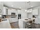 Modern kitchen with an island, stainless steel appliances, and plenty of cabinets at 6416 Willow Pin Ln, Huntersville, NC 28078