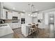 Bright kitchen features an island, modern appliances, and ample cabinet space at 6416 Willow Pin Ln, Huntersville, NC 28078