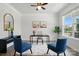 A stylish office space with hardwood floors, a globe, accent chairs, and bright natural light at 6416 Willow Pin Ln, Huntersville, NC 28078