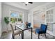 Bright office space with hardwood floors, and a stylish accent chairs, with a door opening to another room at 6416 Willow Pin Ln, Huntersville, NC 28078