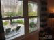 View of backyard patio with outdoor seating and landscaping from inside the house at 700 Valleyview Dr # 1, Albemarle, NC 28001