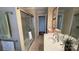 Bathroom with a glass-enclosed shower and a bright vanity area featuring a vessel sink at 700 Valleyview Dr # 1, Albemarle, NC 28001