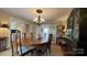 Formal dining room featuring a wooden table, chandelier, and stylish furniture at 700 Valleyview Dr # 1, Albemarle, NC 28001