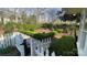 Lush garden with manicured hedges, walkway, black metal fencing, and a serene setting at 700 Valleyview Dr # 1, Albemarle, NC 28001