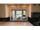 Bright kitchen with granite countertops and 'Bloom Where You Are Planted' script above the window at 700 Valleyview Dr # 1, Albemarle, NC 28001