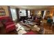 Sunny living room with a plush sofa, bay window, and ample natural light at 700 Valleyview Dr # 1, Albemarle, NC 28001