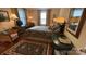 Comfortable primary bedroom featuring hardwood floors, traditional furnishings, and natural light at 700 Valleyview Dr # 1, Albemarle, NC 28001