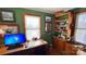 Organized office space with custom wooden shelving, displaying collectible cars and model airplanes at 700 Valleyview Dr # 1, Albemarle, NC 28001