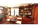 Cozy home office featuring vintage shelves and storage with interesting collection of decorative items at 700 Valleyview Dr # 1, Albemarle, NC 28001