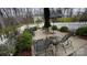 Cozy patio with lounge chairs, outdoor dining set, umbrella, and white picket fence for relaxed outdoor living at 700 Valleyview Dr # 1, Albemarle, NC 28001