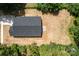 Aerial view of the roof, driveway, and surrounding landscape at 706 Live Oak St, Shelby, NC 28150