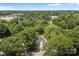 An aerial view captures a charming neighborhood, complete with lush trees and a view of the town at 706 Live Oak St, Shelby, NC 28150