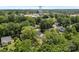 An aerial view captures a charming neighborhood, complete with lush trees and the town's water tower at 706 Live Oak St, Shelby, NC 28150