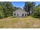 A house with a white vinyl siding and a dry, green backyard with plenty of space at 706 Live Oak St, Shelby, NC 28150