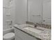 Modern bathroom features granite countertop, sleek white fixtures, and a shower-tub combo at 706 Live Oak St, Shelby, NC 28150
