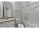 Bathroom featuring granite vanity, and a shower-tub combination at 706 Live Oak St, Shelby, NC 28150