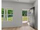 Living room with light wood floors and view of covered porch at 706 Live Oak St, Shelby, NC 28150