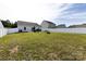 Fenced backyard with a well-maintained lawn, a patio with a grill, and ample space for outdoor enjoyment at 7315 Amberly Hills Rd, Charlotte, NC 28215
