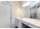 Bright bathroom with a large mirror, white cabinets, and a spacious countertop area, exuding a clean, modern aesthetic at 7315 Amberly Hills Rd, Charlotte, NC 28215