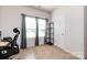 This bright carpeted room offers neutral walls, an electrical outlet, and multiple windows at 7315 Amberly Hills Rd, Charlotte, NC 28215