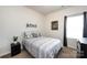 Inviting bedroom with a stylish bed, unique wall decor, and a window providing ample natural light at 7315 Amberly Hills Rd, Charlotte, NC 28215