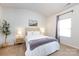Inviting bedroom with neutral carpet, a comfortable bed, and soft, natural light at 7315 Amberly Hills Rd, Charlotte, NC 28215