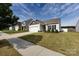 Lovely single-story home with a manicured lawn, two-car garage, and inviting curb appeal in a desirable neighborhood at 7315 Amberly Hills Rd, Charlotte, NC 28215
