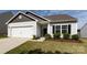 Charming single-story home featuring a two-car garage, well-maintained lawn and attractive landscaping at 7315 Amberly Hills Rd, Charlotte, NC 28215