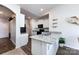 Stylish kitchen features granite countertops, stainless steel sink, black appliances, and an adjacent dining area at 7315 Amberly Hills Rd, Charlotte, NC 28215
