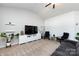 Bright living room with vaulted ceiling, modern lighting and a large comfortable sofa at 7315 Amberly Hills Rd, Charlotte, NC 28215