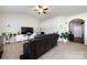 Spacious living room featuring vaulted ceiling, carpet, modern lighting, and comfortable sofa at 7315 Amberly Hills Rd, Charlotte, NC 28215