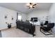 Comfortable living room with vaulted ceiling, modern lighting and a large comfortable sofa at 7315 Amberly Hills Rd, Charlotte, NC 28215
