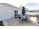 Cozy patio area with an outdoor dining set, grill, and convenient access to the house through a sliding glass door at 7315 Amberly Hills Rd, Charlotte, NC 28215