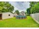 An expansive backyard features a pool, outdoor furniture, and a detached garage at 8 Cauthen St, Rock Hill, SC 29730