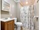 This bathroom features a vanity, toilet, and shower with neutral paint tones at 8 Cauthen St, Rock Hill, SC 29730
