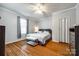 Serene bedroom featuring hardwood floors, a ceiling fan, and natural light at 8 Cauthen St, Rock Hill, SC 29730
