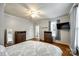 This bedroom features hardwood floors, two dressers, a ceiling fan, and a wall-mounted television at 8 Cauthen St, Rock Hill, SC 29730
