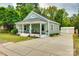 Inviting home with a covered front porch, a long driveway, and a detached garage at 8 Cauthen St, Rock Hill, SC 29730