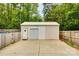 A detached garage with parking and garage door and a surrounding fence at 8 Cauthen St, Rock Hill, SC 29730