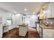 Functional kitchen with granite countertops, white cabinetry, and wood-look flooring at 8 Cauthen St, Rock Hill, SC 29730