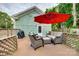 Outdoor patio set with a red umbrella and a grill near the house at 8 Cauthen St, Rock Hill, SC 29730